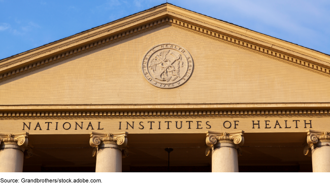 National Institutes of Health sign above four pillars on its building