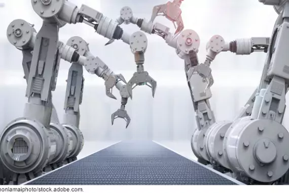 Photo illustration of robotic arms on an assembly line