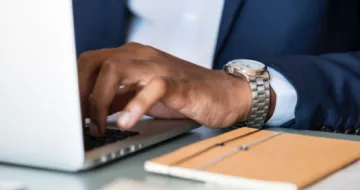 Businessman typing on a computer